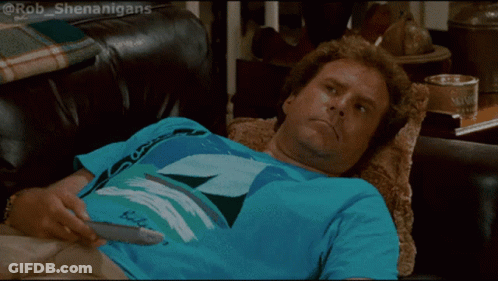 A Man Laying On A Couch Wearing A Blue Shirt That Says ' Bob ' On It GIF