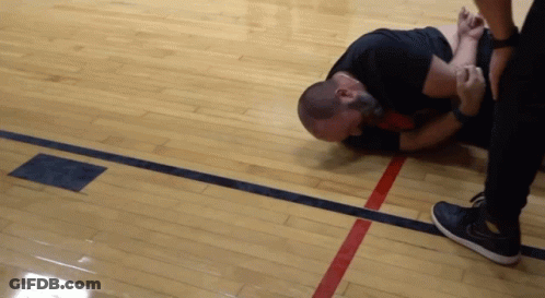 Man Lying On Floor With Red Line Between Him And Another Man GIF