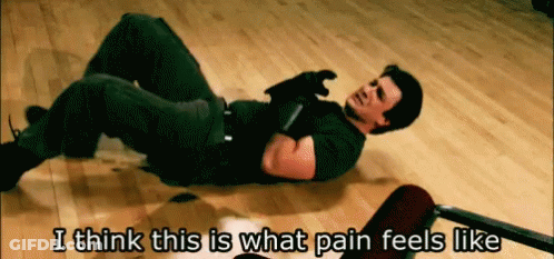 A Man Laying On The Floor With The Words " I Think This Is What Pain Feels Like " Below Him GIF