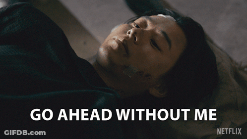 A Man Laying On The Ground With The Words Go Ahead Without Me Written Below Him GIF