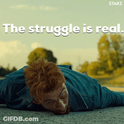 A Man Laying On The Ground With The Words " The Struggle Is Real " Written Above Him GIF