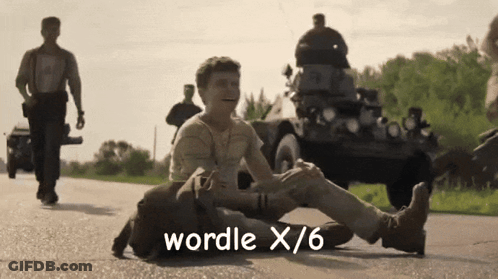 A Man Laying On The Ground With The Words Wordle X / 6 Written On The Bottom GIF