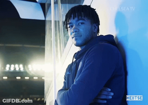 A Man Leaning Against A Wall With Chelsea Tv Written On The Bottom GIF