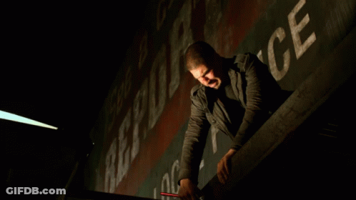 A Man Leaning Over A Railing With The Words " They Better Not Miss " Behind Him GIF