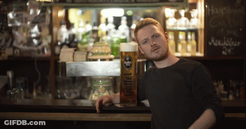 Man Leaning Against Bar With Goffel Beer GIF
