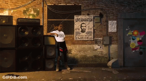 A Man Leans Against A Wall With A Poster That Says Love Generation On It GIF