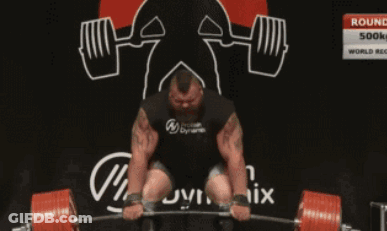 A Man Lifting A Barbell In Front Of A Sign That Says Round 3 GIF