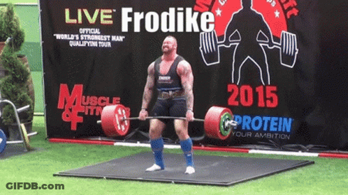 A Man Lifts A Barbell In Front Of A Sign That Says Live Frodike GIF