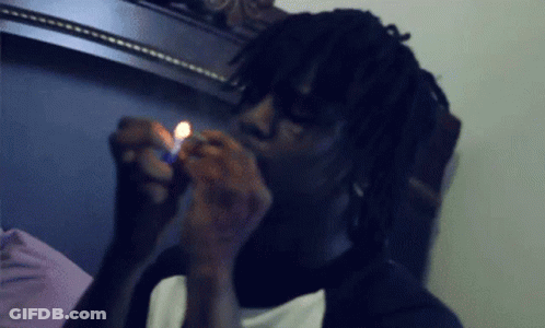 A Man Lighting A Cigarette With A Lighter GIF