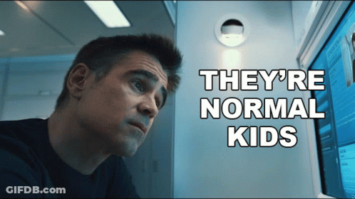 A Man Looking At A Computer Screen With The Words " They 'Re Normal Kids " Behind Him GIF