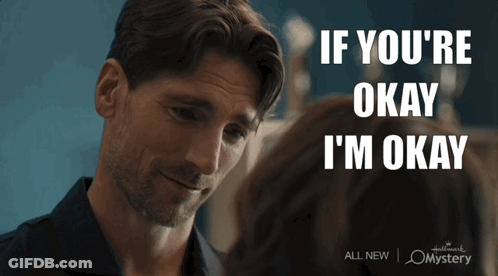 A Man Looking At A Woman With The Words If You 'Re Okay I 'M Okay On The Bottom GIF