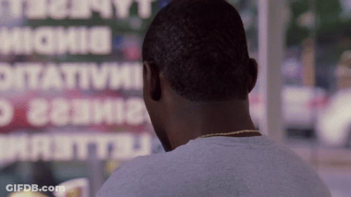 A Man Looking Out A Window At A Sign That Says ' Ottavia ' GIF