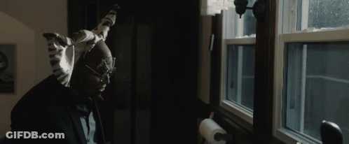 A Man Looking Out A Window With A Paper Towel Hanging On The Wall GIF
