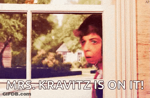 A Man Looking Out A Window With The Words Mrs Kravitz Is On It Written Below Him GIF