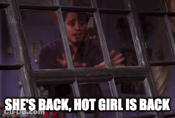 A Man Looking Out A Window With The Words She 'S Back Hot Girl Is Back Written Below Him GIF
