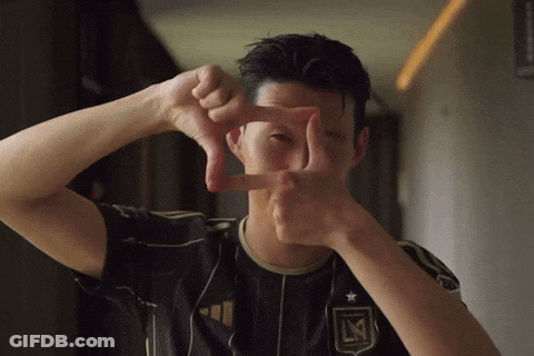 A Man Making A Frame With His Hands With The Letter L On It GIF
