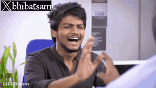 A Man Making A Funny Face In Front Of A Banner That Says X Bhibatsam GIF