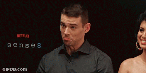 A Man Making A Funny Face In Front Of A Netflix Logo GIF
