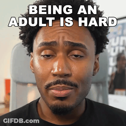 A Man Making A Funny Face With The Words Being An Adult Is Hard Written Above Him GIF