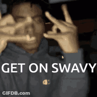 A Man Making A Peace Sign With His Hands And The Words Get On Swavy Written Below Him GIF
