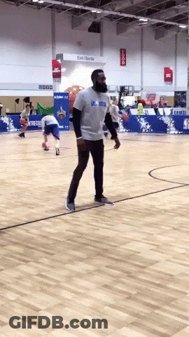 A Man On A Basketball Court Wearing A Shirt That Says Lsu Bruins GIF