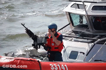 A Man On A Boat With The Number 33143 On The Side Of It GIF