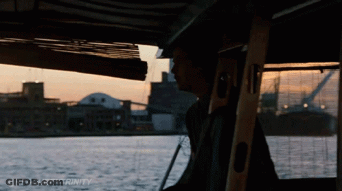 A Man On A Boat With The Words @Redqueentrinity Written On The Bottom GIF