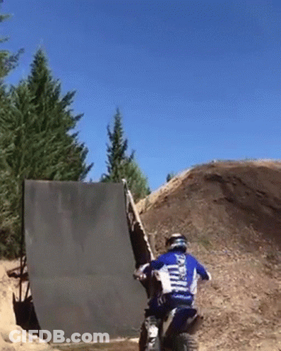 A Man On A Dirt Bike Wearing A Shirt That Says ' Yamaha ' On The Back Of It GIF