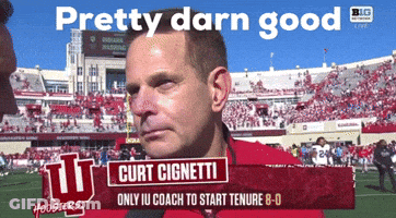 A Man On A Football Field Is Being Interviewed By Curt Cignetti GIF