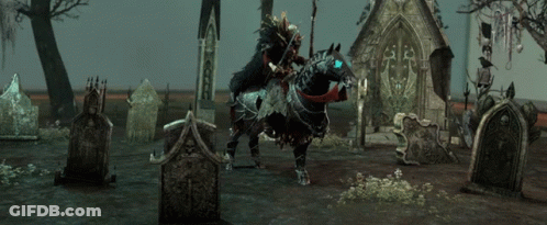 A Man On A Horse In A Cemetery With A Sign That Says ' A ' GIF