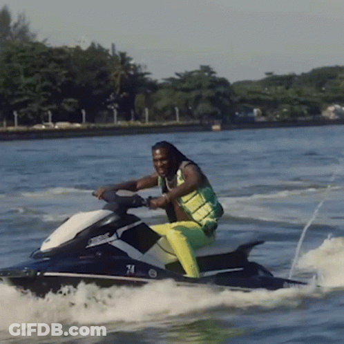 A Man On A Jet Ski With The Number 74 On It GIF