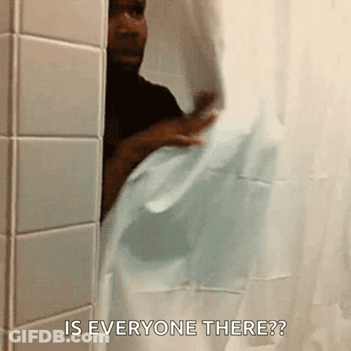 A Man Peeking Out From Behind A Shower Curtain With The Words Is Everyone There GIF