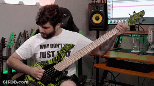 A Man Playing A Bass Guitar With A Shirt That Says Why Don T You Just Play GIF