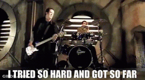 A Man Playing A Guitar And Another Man Playing Drums With The Words I Tried So Hard And Got So Far Below Them GIF