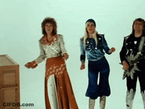 A Man Playing A Guitar And Two Women Dancing In Front Of A White Background GIF