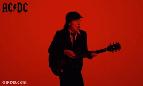 A Man Playing A Guitar In Front Of A Red Background With Ac Dc Written On It GIF