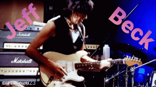 A Man Playing A Guitar Next To A Marshall Amp GIF