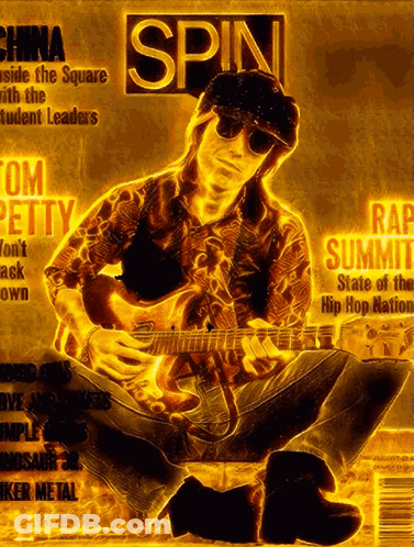 A Man Playing A Guitar On The Cover Of A Magazine Titled Spin GIF