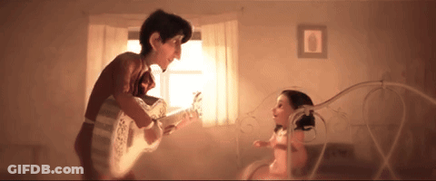 A Man Playing A Guitar To A Little Girl GIF