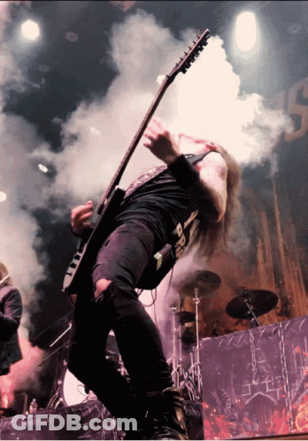 A Man Playing A Guitar With A Shirt That Says ' Death ' GIF