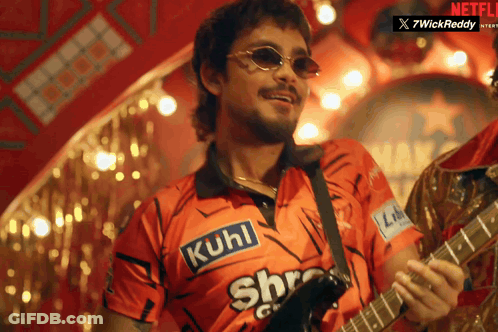 A Man Playing A Guitar With A Shirt That Says Kuhl On It GIF