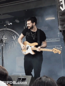 A Man Playing A Guitar With A Shirt That Says Pl GIF