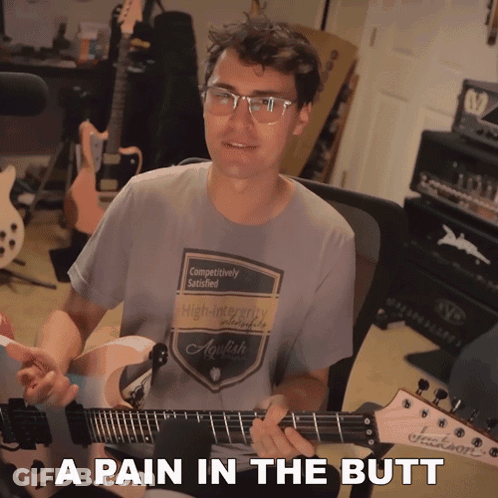 Man Playing Guitar With A Pain In The Butt GIF
