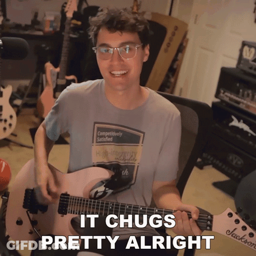 A Man Playing A Guitar With The Words " It Chugs Pretty Alright " On The Bottom GIF