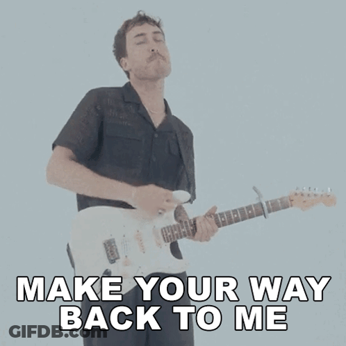 A Man Playing A Guitar With The Words Make Your Way Back To Me GIF