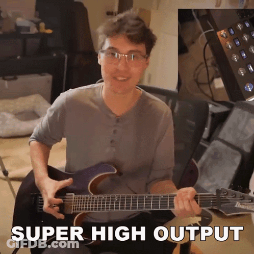 A Man Playing A Guitar With The Words Super High Output Written Below Him GIF