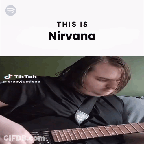 A Man Playing A Guitar With The Words " This Is Nirvana " Behind Him GIF