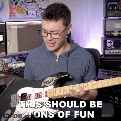 A Man Playing A Guitar With The Words " This Should Be Tons Of Fun " Written Below Him GIF