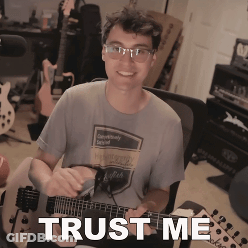 Man Playing Guitar With Trust Me Text GIF