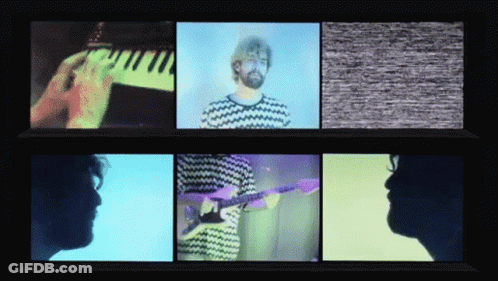 A Man Playing A Piano And A Man Playing A Guitar GIF